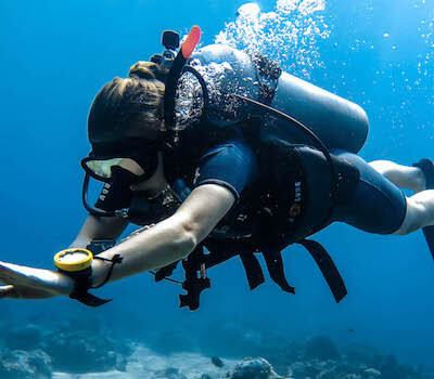 A diver practices a navigation technique.
