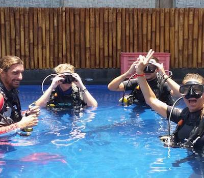 Divers prepare to start their rescue practice in the pool.
